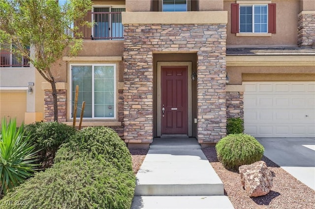3609 Kingfishers Catch Ave, North Las Vegas, NV 89084 - doorway to property with stucco siding, stone siding, and an attached garage
