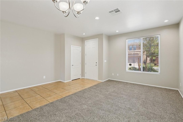 3609 Kingfishers Catch Ave, North Las Vegas, NV 89084 - empty room featuring light carpet, light tile patterned floors, a chandelier, and recessed lighting