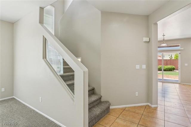 3609 Kingfishers Catch Ave, North Las Vegas, NV 89084 - stairs with baseboards and tile patterned floors