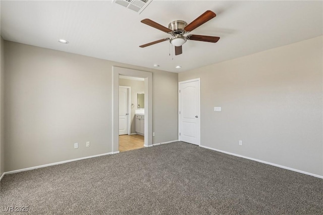 3609 Kingfishers Catch Ave, North Las Vegas, NV 89084 - unfurnished bedroom featuring light carpet, recessed lighting, ensuite bathroom, and a ceiling fan