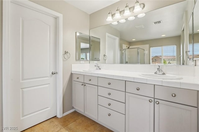 3609 Kingfishers Catch Ave, North Las Vegas, NV 89084 - full bath featuring a stall shower, double vanity, and tile patterned floors
