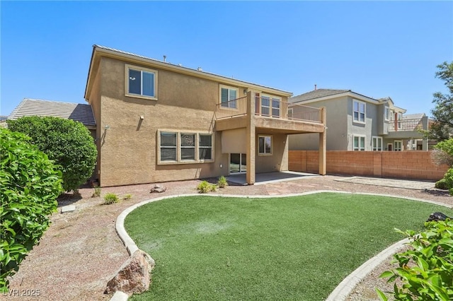 3609 Kingfishers Catch Ave, North Las Vegas, NV 89084 - back of house with a balcony, stucco siding, and a patio area