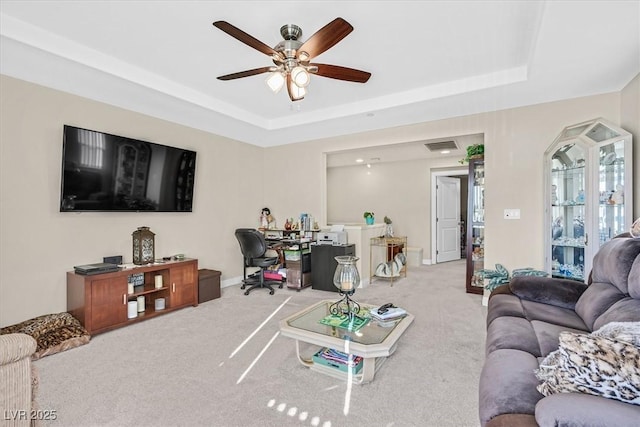 2194 Trivero St, Henderson, NV 89044 - living room featuring a raised ceiling, a ceiling fan, and carpet flooring