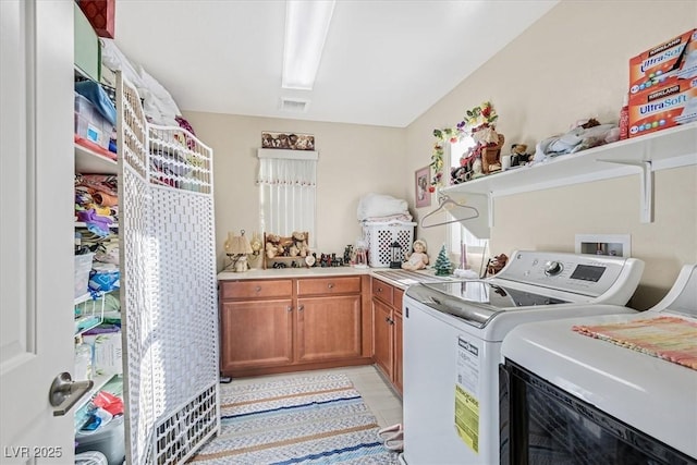 2194 Trivero St, Henderson, NV 89044 - washroom featuring independent washer and dryer, cabinet space, and light tile patterned flooring