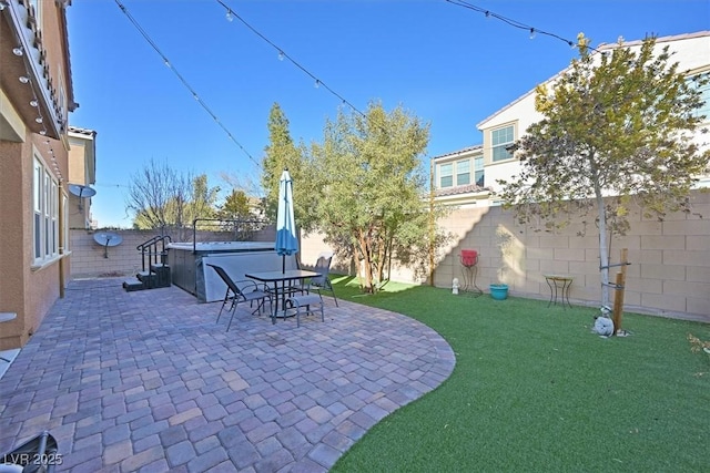 2194 Trivero St, Henderson, NV 89044 - fenced backyard with a hot tub and a patio