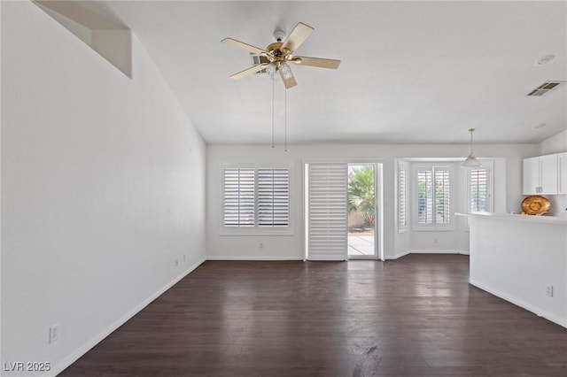 6209 Lenaking Ave, Las Vegas, NV 89122 - unfurnished living room featuring dark wood-style flooring and ceiling fan