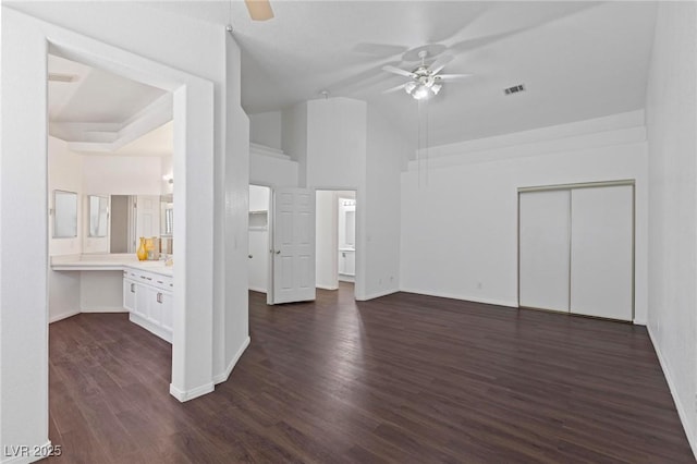 6209 Lenaking Ave, Las Vegas, NV 89122 - unfurnished living room featuring ceiling fan, dark wood-type flooring, and lofted ceiling