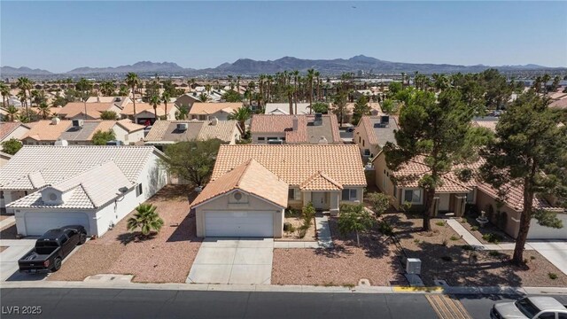 6209 Lenaking Ave, Las Vegas, NV 89122 - aerial perspective of suburban area with a mountain backdrop