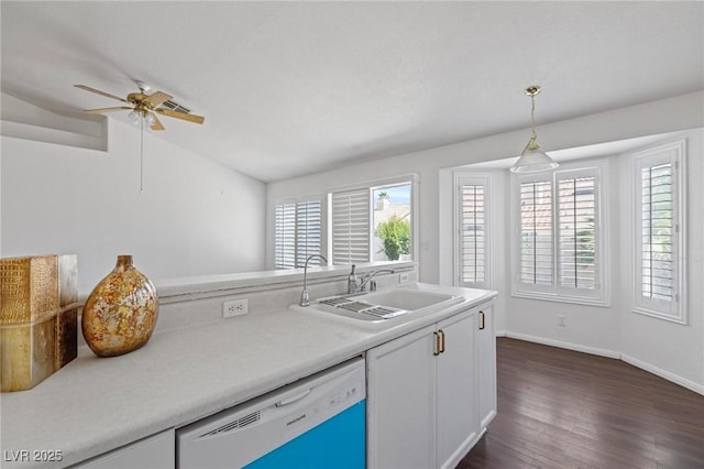 6209 Lenaking Ave, Las Vegas, NV 89122 - kitchen with white dishwasher, plenty of natural light, ceiling fan, dark wood-type flooring, and lofted ceiling