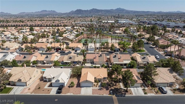 6209 Lenaking Ave, Las Vegas, NV 89122 - aerial overview of property's location with nearby suburban area and a mountainous background