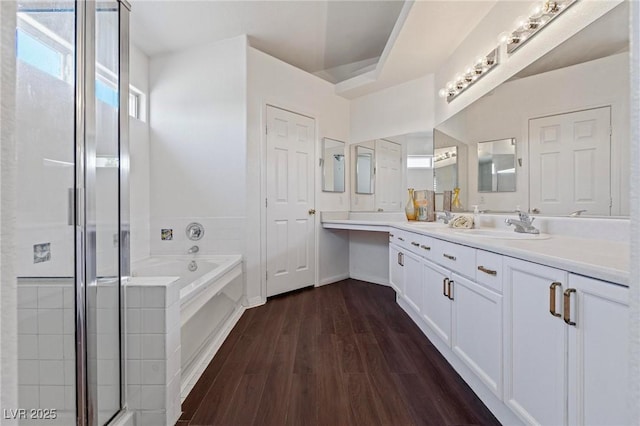 6209 Lenaking Ave, Las Vegas, NV 89122 - full bath featuring vanity, a bath, a stall shower, and wood finished floors