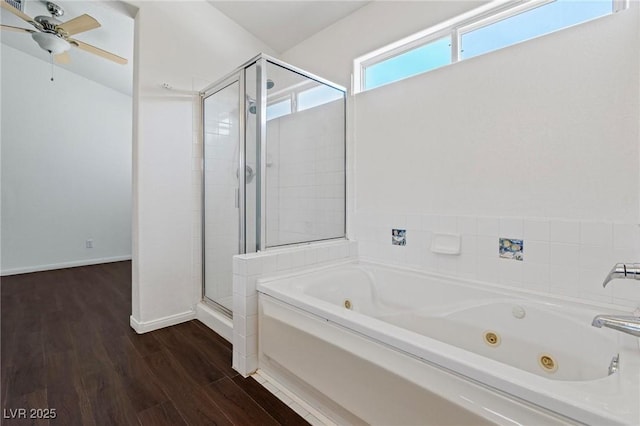 6209 Lenaking Ave, Las Vegas, NV 89122 - full bathroom featuring a stall shower, a jetted tub, wood finished floors, and a ceiling fan