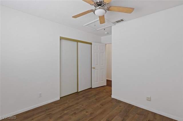 6209 Lenaking Ave, Las Vegas, NV 89122 - unfurnished bedroom with wood finished floors, a closet, a ceiling fan, and attic access