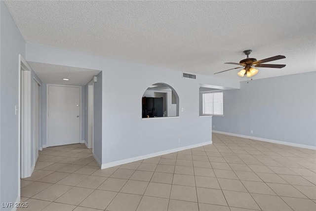 4784 El Escorial Dr, Las Vegas, NV 89121 - unfurnished room featuring a textured ceiling, ceiling fan, and light tile patterned floors