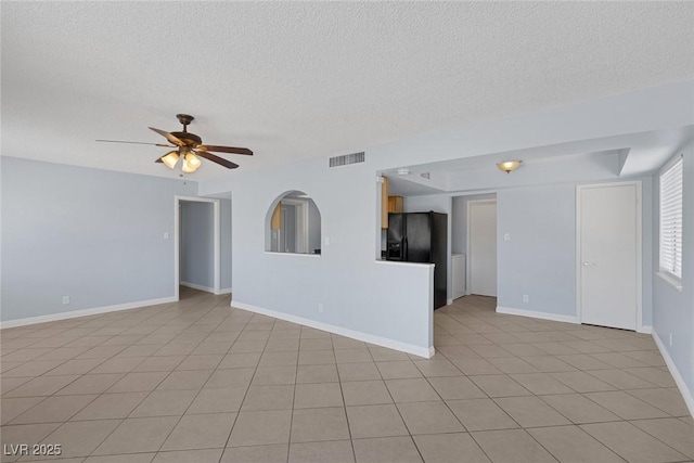 4784 El Escorial Dr, Las Vegas, NV 89121 - unfurnished living room with a textured ceiling, a ceiling fan, and light tile patterned flooring