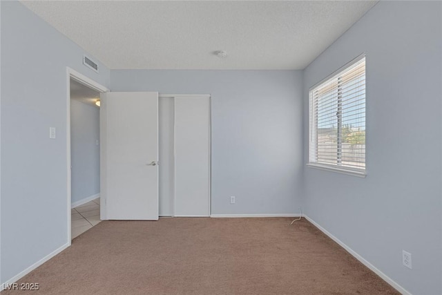 4784 El Escorial Dr, Las Vegas, NV 89121 - unfurnished bedroom with carpet floors, a closet, and a textured ceiling
