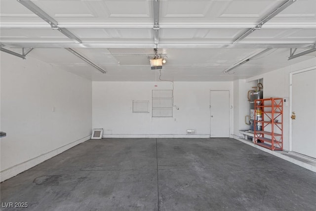 4784 El Escorial Dr, Las Vegas, NV 89121 - garage featuring a garage door opener and strapped water heater