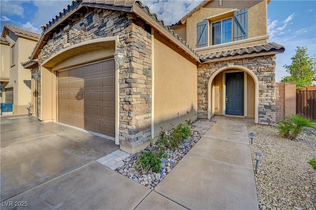 7311 Spring Flower Ave, Las Vegas, NV 89117 - view of front facade featuring stucco siding, stone siding, a tiled roof, and an attached garage