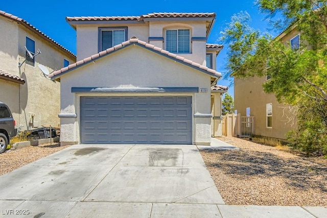 4118 Beech Family St, Las Vegas, NV 89115 - mediterranean / spanish-style home with concrete driveway, stucco siding, a tile roof, and an attached garage