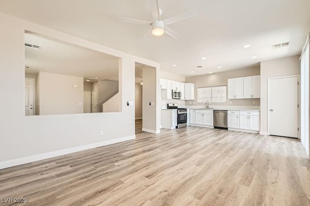 4118 Beech Family St, Las Vegas, NV 89115 - unfurnished living room featuring light wood-type flooring, a ceiling fan, and recessed lighting
