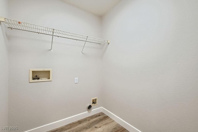 4118 Beech Family St, Las Vegas, NV 89115 - washroom with light wood-style flooring and washer hookup