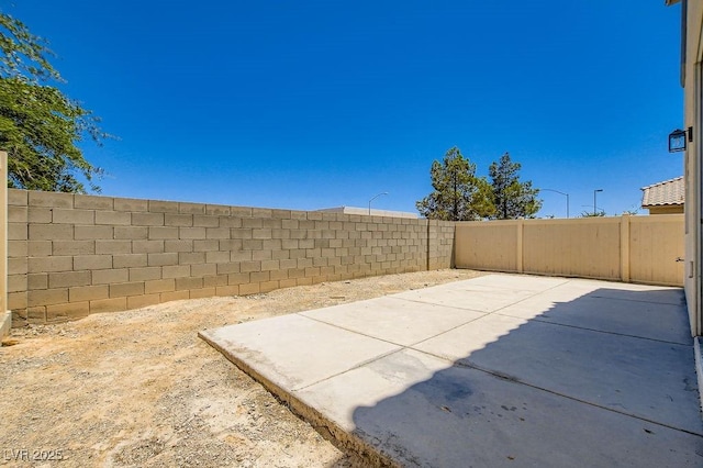 4118 Beech Family St, Las Vegas, NV 89115 - fenced backyard featuring a patio area