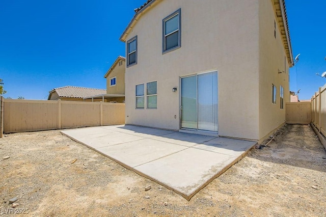 4118 Beech Family St, Las Vegas, NV 89115 - back of property with stucco siding, a fenced backyard, and a patio