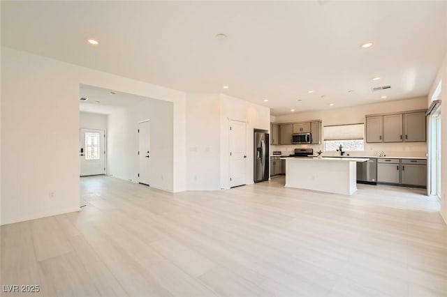 5804 Gossamer Stone Ct, Las Vegas, NV 89141 - unfurnished living room with recessed lighting and light wood-style flooring