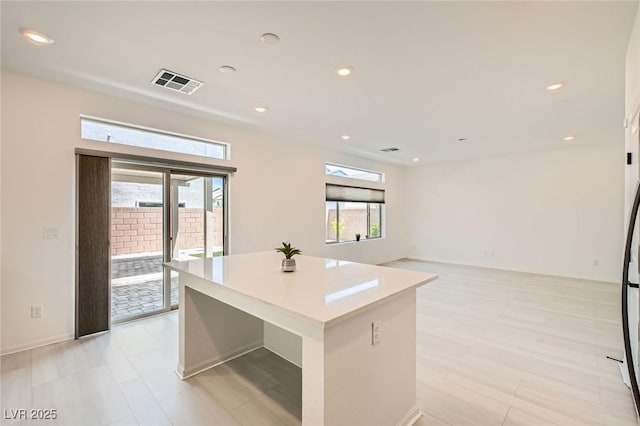 5804 Gossamer Stone Ct, Las Vegas, NV 89141 - kitchen featuring a kitchen island, recessed lighting, and light countertops