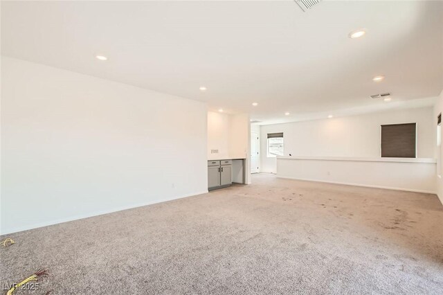 5804 Gossamer Stone Ct, Las Vegas, NV 89141 - unfurnished living room featuring light colored carpet and recessed lighting