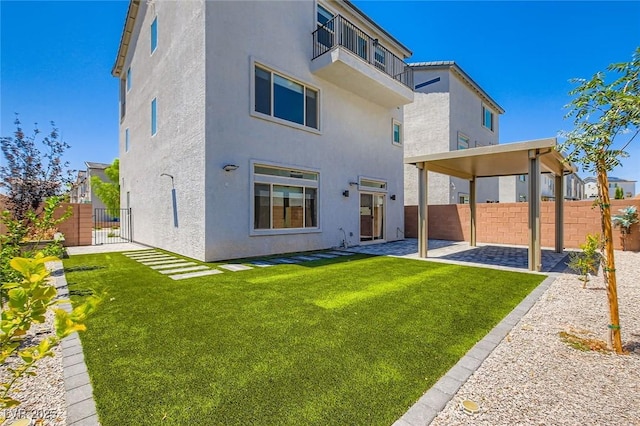 5804 Gossamer Stone Ct, Las Vegas, NV 89141 - rear view of house featuring stucco siding, a fenced backyard, and a patio