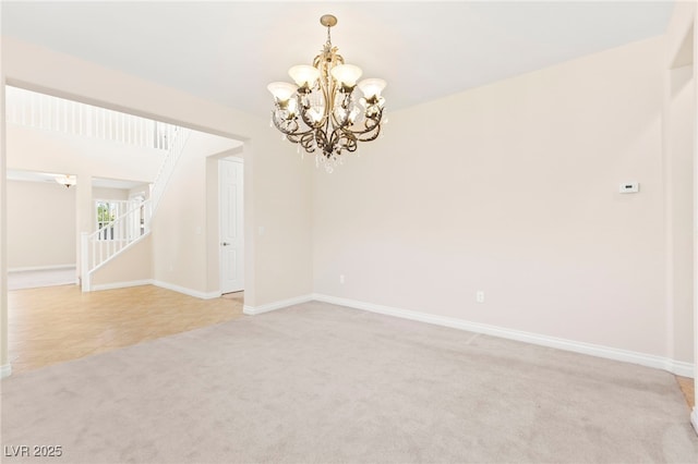 2755 Asgard Ave, Las Vegas, NV 89121 - unfurnished room featuring a chandelier, light colored carpet, stairs, and light tile patterned floors