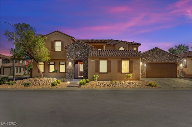 2755 Asgard Ave, Las Vegas, NV 89121 - view of front facade with a tile roof, stucco siding, stone siding, and driveway