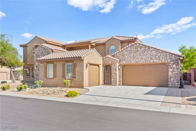 2755 Asgard Ave, Las Vegas, NV 89121 - mediterranean / spanish house featuring an attached garage, stucco siding, a tiled roof, and driveway
