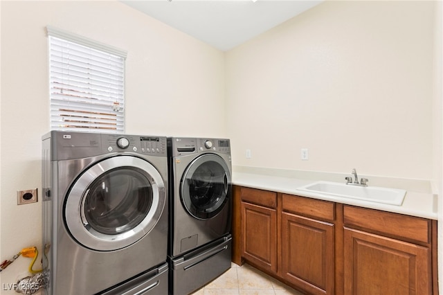 2755 Asgard Ave, Las Vegas, NV 89121 - washroom with washing machine and clothes dryer, light tile patterned flooring, and cabinet space