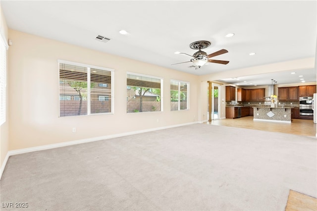 2755 Asgard Ave, Las Vegas, NV 89121 - unfurnished living room featuring recessed lighting, ceiling fan, and light carpet