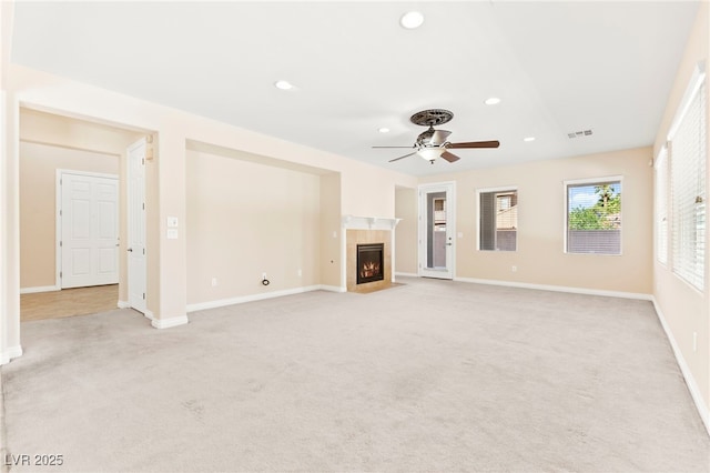 2755 Asgard Ave, Las Vegas, NV 89121 - unfurnished living room featuring light colored carpet, ceiling fan, recessed lighting, and a tile fireplace