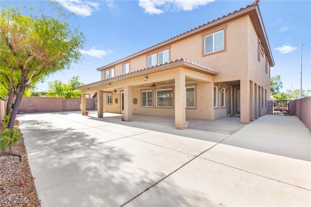 2755 Asgard Ave, Las Vegas, NV 89121 - rear view of house with ceiling fan, stucco siding, a patio, and a fenced backyard