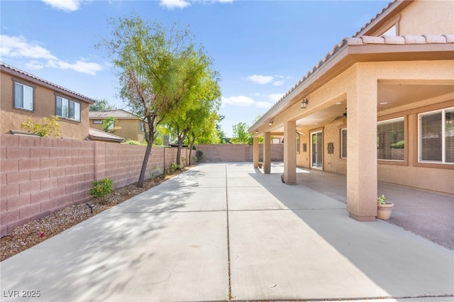 2755 Asgard Ave, Las Vegas, NV 89121 - fenced backyard featuring a patio and a ceiling fan