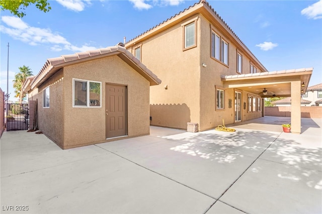 2755 Asgard Ave, Las Vegas, NV 89121 - rear view of property with a patio, stucco siding, ceiling fan, a tile roof, and a gate