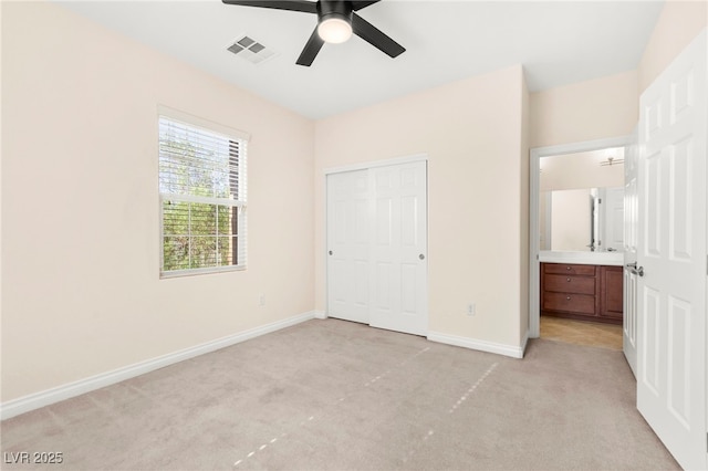 2755 Asgard Ave, Las Vegas, NV 89121 - unfurnished bedroom with light colored carpet, a closet, and ceiling fan
