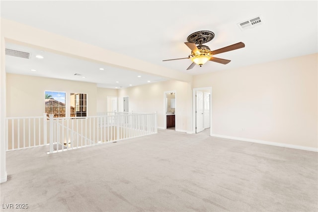 2755 Asgard Ave, Las Vegas, NV 89121 - spare room featuring light colored carpet, a ceiling fan, and recessed lighting