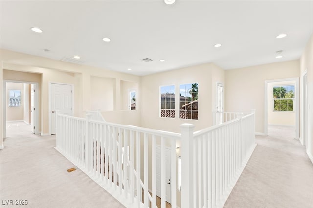 2755 Asgard Ave, Las Vegas, NV 89121 - hallway featuring light colored carpet, an upstairs landing, and recessed lighting