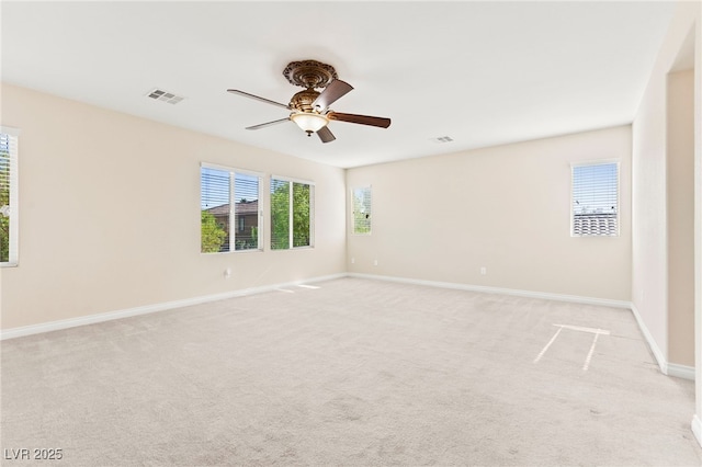 2755 Asgard Ave, Las Vegas, NV 89121 - empty room featuring ceiling fan, healthy amount of natural light, and light colored carpet