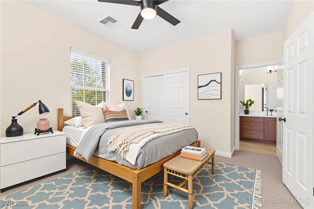 2755 Asgard Ave, Las Vegas, NV 89121 - bedroom featuring light colored carpet, ceiling fan, a closet, and ensuite bath