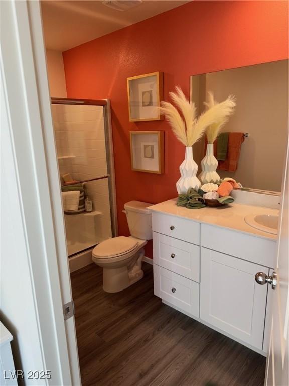 1900 Arietta Vista St, Henderson, NV 89044 - bathroom featuring vanity, wood finished floors, and a shower stall