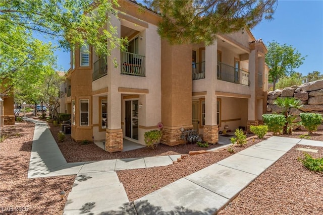 224 Morgyn Ln Unit 6, Boulder City, NV 89005 - view of front of house with stucco siding and a balcony