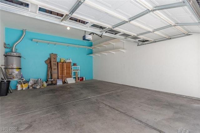 224 Morgyn Ln Unit 6, Boulder City, NV 89005 - garage featuring a garage door opener and water heater