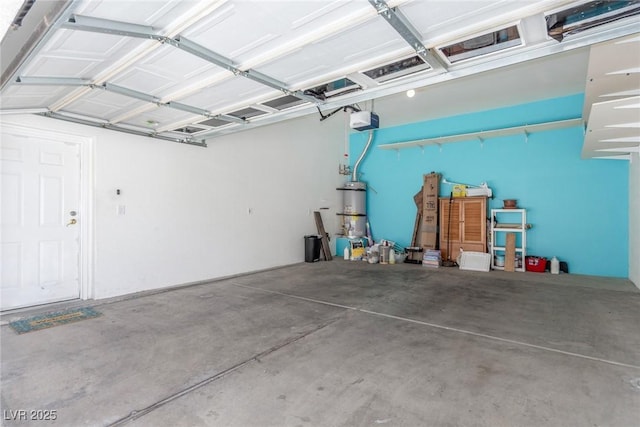 224 Morgyn Ln Unit 6, Boulder City, NV 89005 - garage featuring a garage door opener and water heater