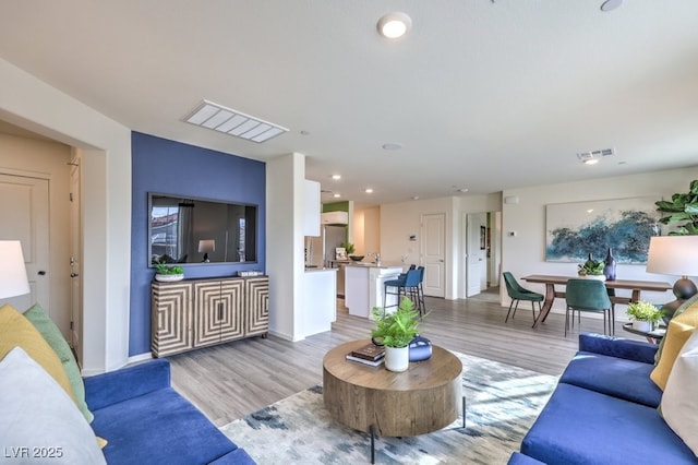 7965 Aurora Sky St Unit 621, North Las Vegas, NV 89084 - living area featuring light wood finished floors and recessed lighting